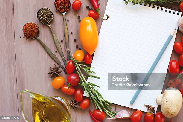 Notepads Recipes On A Wooden Table Fresh Vegetables Stock Photo - Download Image Now