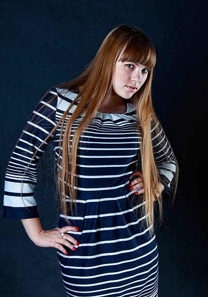 Girl wearing striped dress stock photo