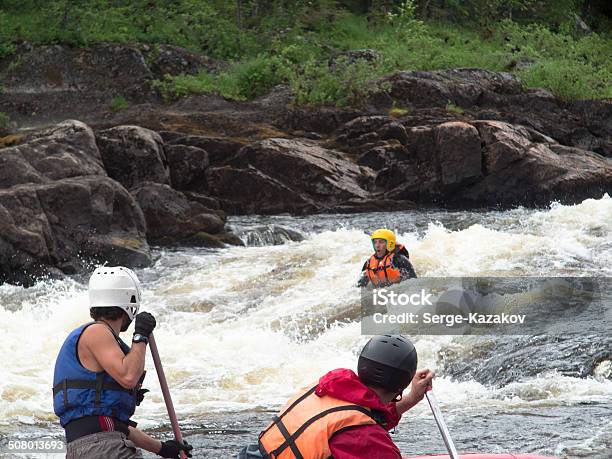 Two Rowers On The Catamaran Trying To Save Stock Photo - Download Image Now - Rescue, People, River