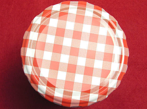 istock Checked screw lid for glasses and a red background 508014239