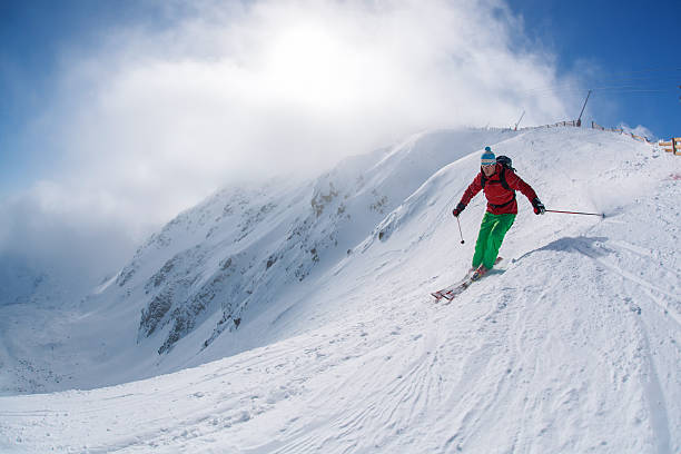 istock Skier skiing downhill in high mountains against sunset 508015343