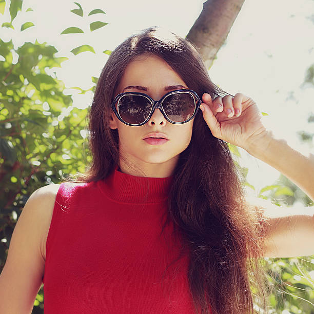 istock Female model in sunglasses looking outdoors. Closeup portrait 508015723