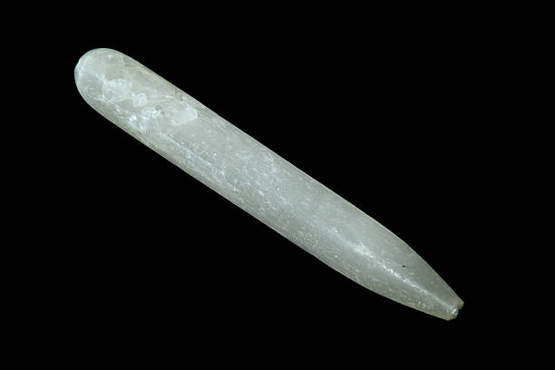 istock selenite gypsum wand  over black 508015967