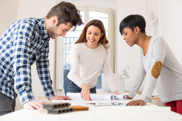 istock Team of young architects working on building plans 508023546