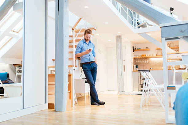 istock Handsome business at home holding phone 508024932