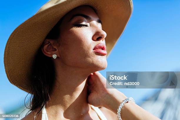 Glamorous Woman Looking Towards The Sun Stock Photo - Download Image Now - Human Lips, Sea, Women