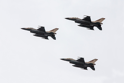  Netanya, Israel -May 06, 2014: Army fighter jet F-16 performing an exhibition exercise during the Israeli Independence day show on April 06, 2014 in Netanya, Israel.