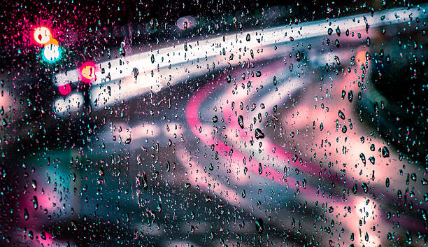 istock Raindrops on a window with moving trails on the background 508028388