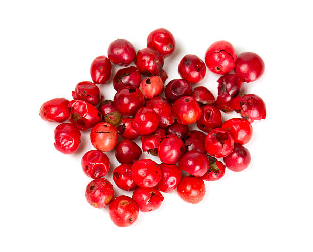 pink peppercorn isolated on white pink peppercorn isolated on white pink pepper spice ingredient stock pictures, royalty-free photos & images