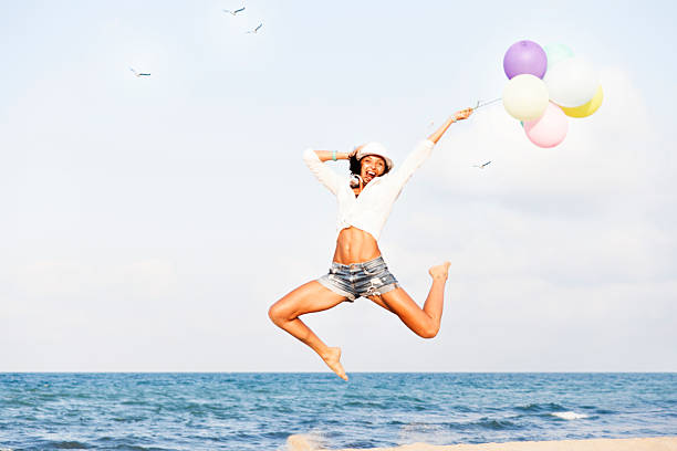 istock Woman jumping on the beach 508032990