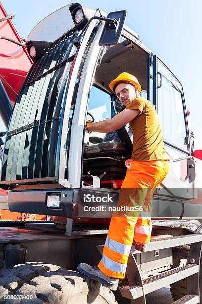 Driver Gets On His Truck In Landfill Stock Photo - Download Image Now - Truck Driver, Adult, Blue-collar Worker