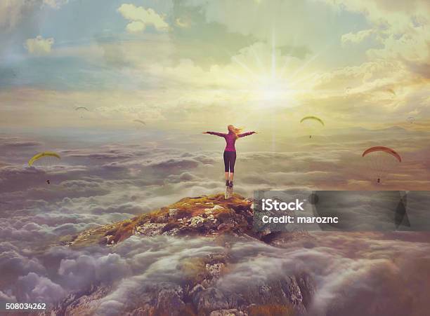 Young Woman Standing On A Rock With Divorced Hands Stock Photo - Download Image Now