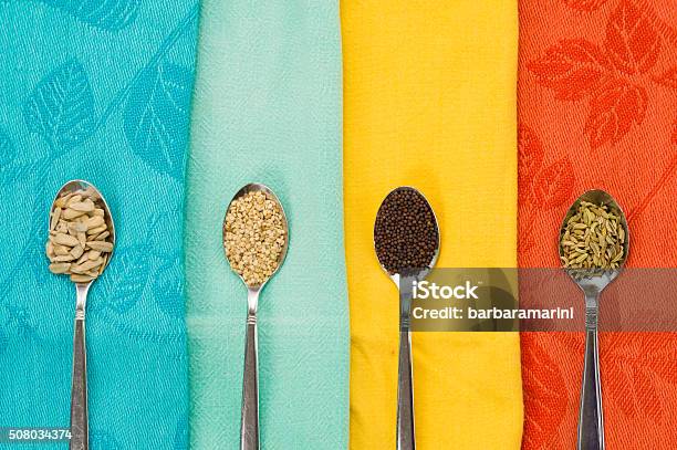 Spoon Of Sunflower Sesame Fennel Mustard Seeds For Macrobiotic Food Stock Photo - Download Image Now