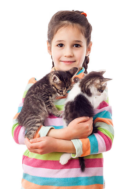 istock Little girl hugging two adorable kitten 508034774