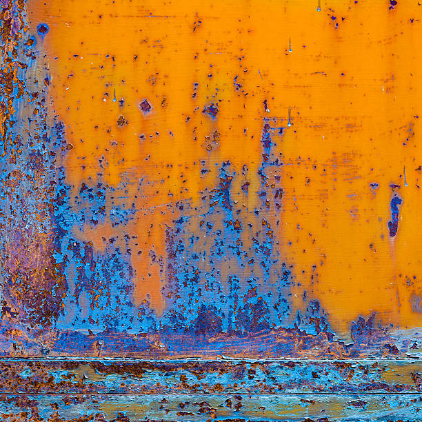 Rusty painted metal with cracked paint. Orange and blue colors. Texture color grunge background