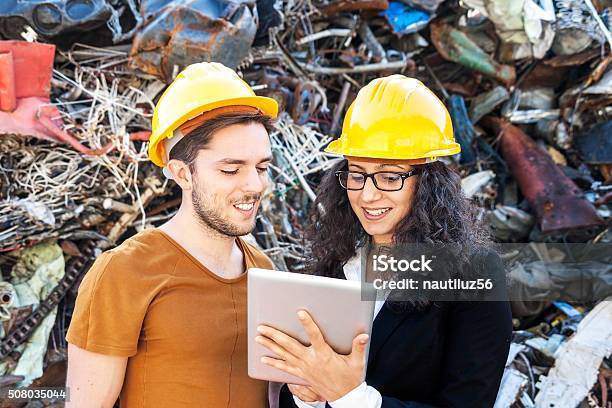 Young Female Engineer Plans The Work With A Collaborator Stock Photo - Download Image Now