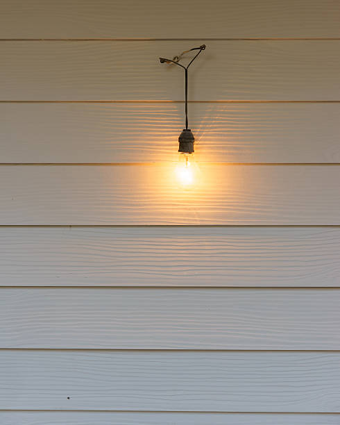 istock vintage lamps hanging on white  wall 508035284