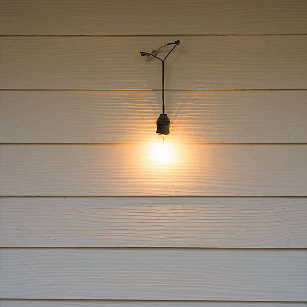 istock vintage lamps hanging on white  wall 508035338