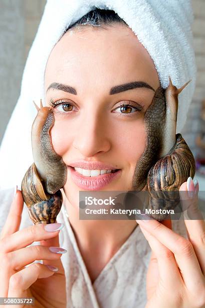 Portrait Of Woman With Snails On Her Face Stock Photo - Download Image Now - Dermatology, Adult, Animal