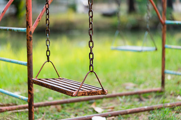 istock Old rusty playground swing in the park 508035902