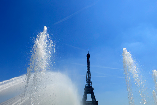 Paris, the Eiffel Tower, beautiful monument in summer, with water jets at Trocadero