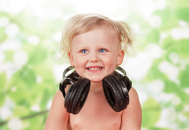 istock Little baby with headphones 508036968