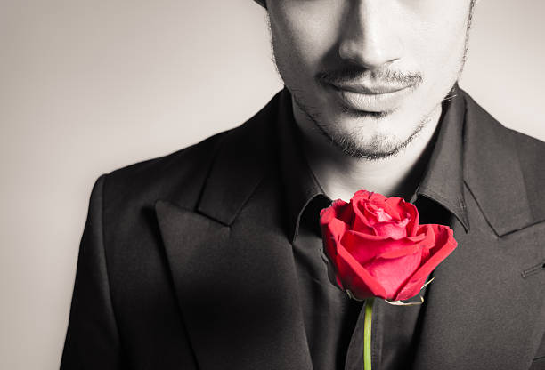 Man with rose Handsome man with single rose. Love concept. blind date stock pictures, royalty-free photos & images
