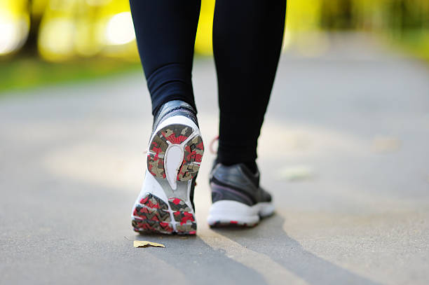 istock Runner feet running by road closeup on shoe 508039330