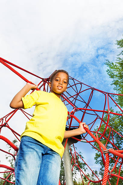 istock African boy holds and stands on red ropes 508044873
