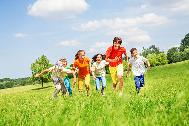 istock Funny children running in the field 508046273