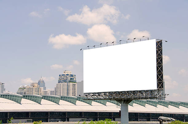 istock large blank billboard on road with city view background 508047099