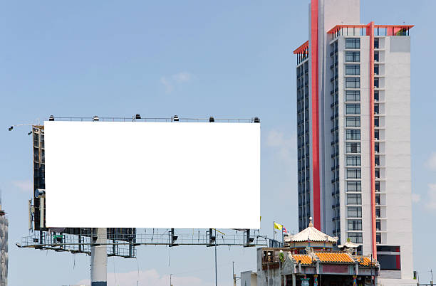 istock large blank billboard on road with city view background 508047107
