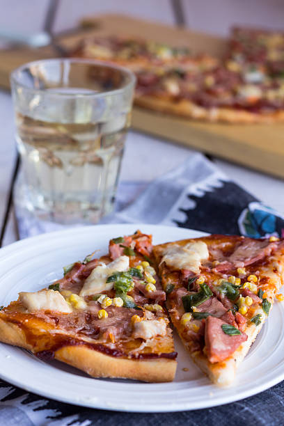 istock pizza with sausage, chicken, corn and cheese 508047277