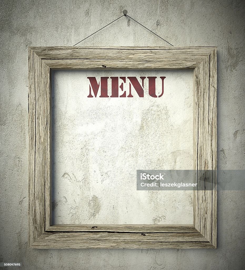 Menu in old wooden frame on wall Menu in old wooden frame on aged wall Art And Craft Stock Photo