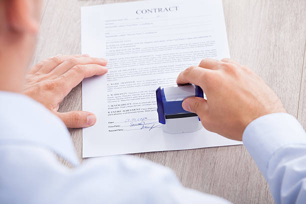 istock Businessman Stamping Contract Paper On Table 508051091