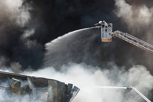 Fire fighting and black smoke stock photo
