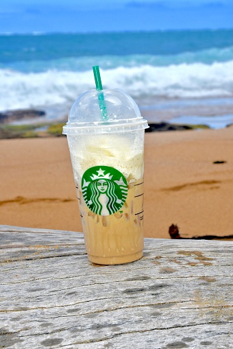 Condado, Puerto Rico - January 25, 2016: A Starbucks coffee on the beach in Condado, Puerto Rico. Starbucks Corporation is an American coffee company and coffeehouse chain.
