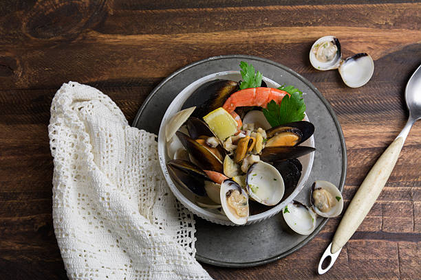istock Seafood in bowl, wooden background 508053714