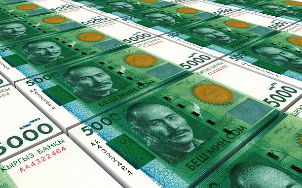 istock Kyrgyzstani som bills stacks background 508057792
