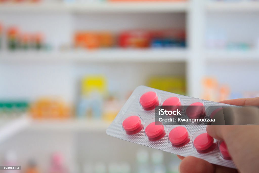 Close up of pharmacist hands holding medicine pills Acetylsalicylic Acid Stock Photo