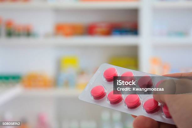 Close Up Of Pharmacist Hands Holding Medicine Pills Stock Photo - Download Image Now