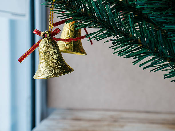 istock Gold bell toy on christmas tree 508059816