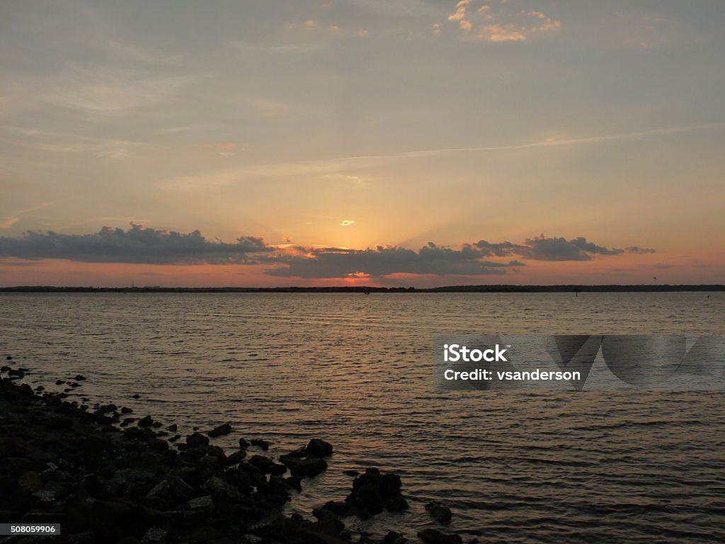 Sunset over barrier islands along the Coast of North Carolina From the south end of Wrightsville Beach, NC Beach Stock Photo