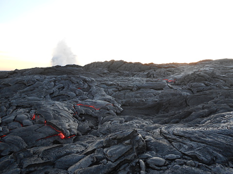 Hot Lava Flowing on Big Island, Hawaii during Sunset.