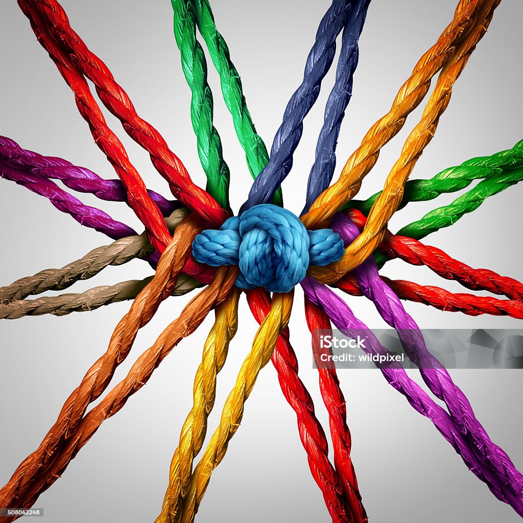 Group Holding Together Group holding together as different ropes connected and tied and linked together in the center by a knot as a strong  unbreakable chain and community trust and faith metaphor. Multiracial Group Stock Photo