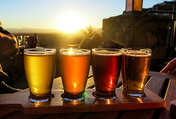 Colorful beer flight on a wooden table stock photo