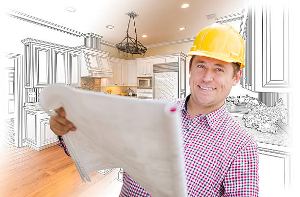 istock Contractor Holding Blueprints Over Custom Kitchen Drawing and Photo 508064126