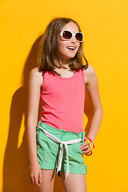 istock Little girl on yellow background 508070319