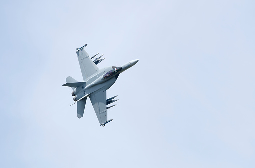 US Navy F/A-18F Super Hornet fly past. The F/A-18F is a twin-engine, carrier-capable multirole combat jet currently operated by the United States Navy and the Royal Australian Air Force.