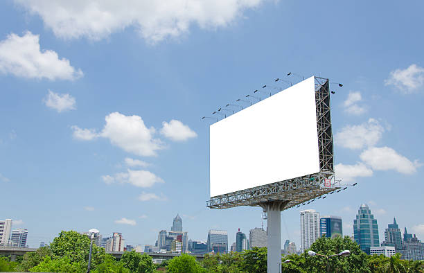 istock large blank billboard on road with city view background 508071437